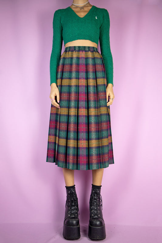 The Vintage 90s Plaid Pleated Midi Skirt is a classic preppy style green, maroon and mustard check pleated maxi skirt with an elasticated waist.