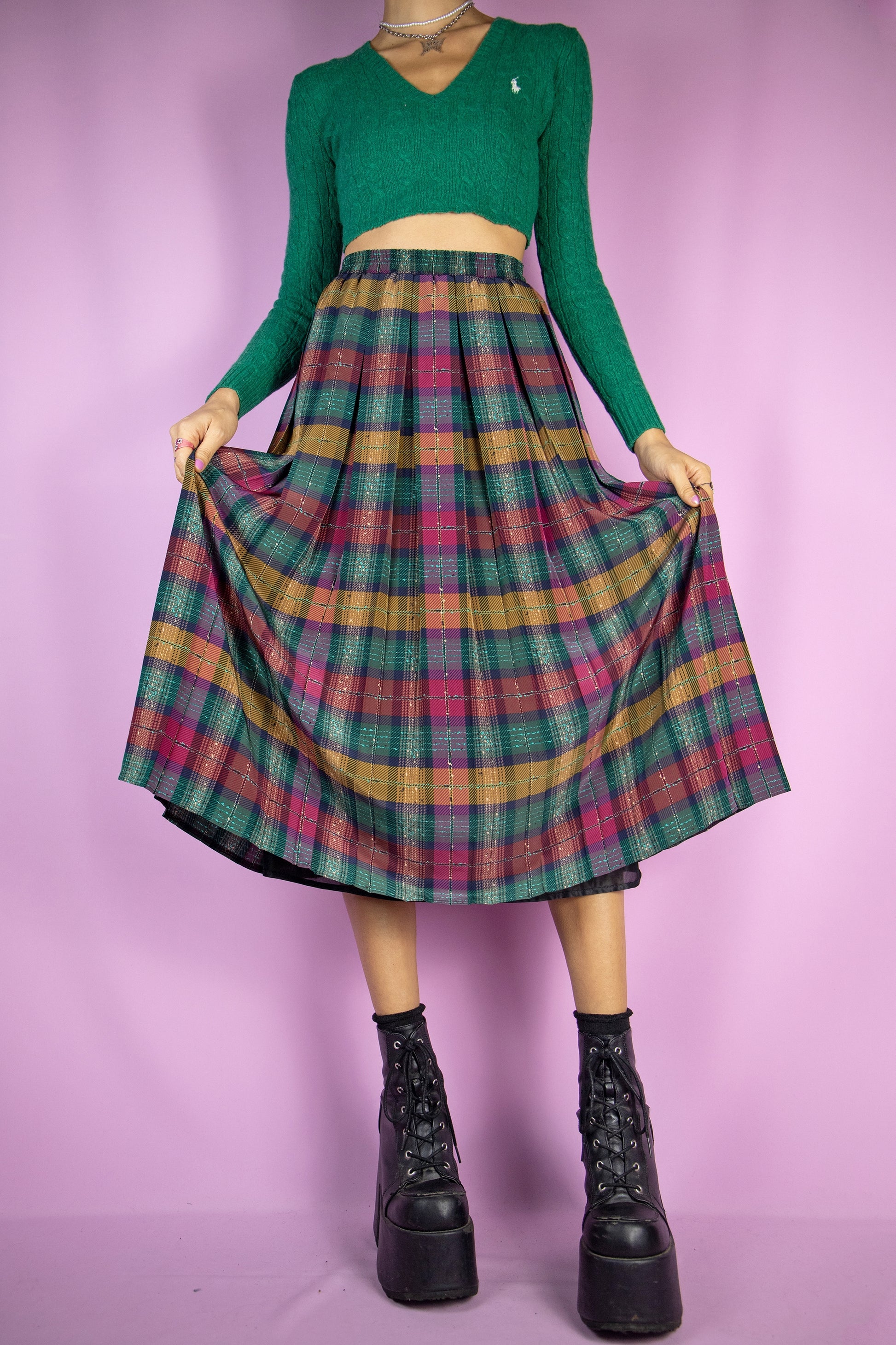 The Vintage 90s Plaid Pleated Midi Skirt is a classic preppy style green, maroon and mustard check pleated maxi skirt with an elasticated waist.