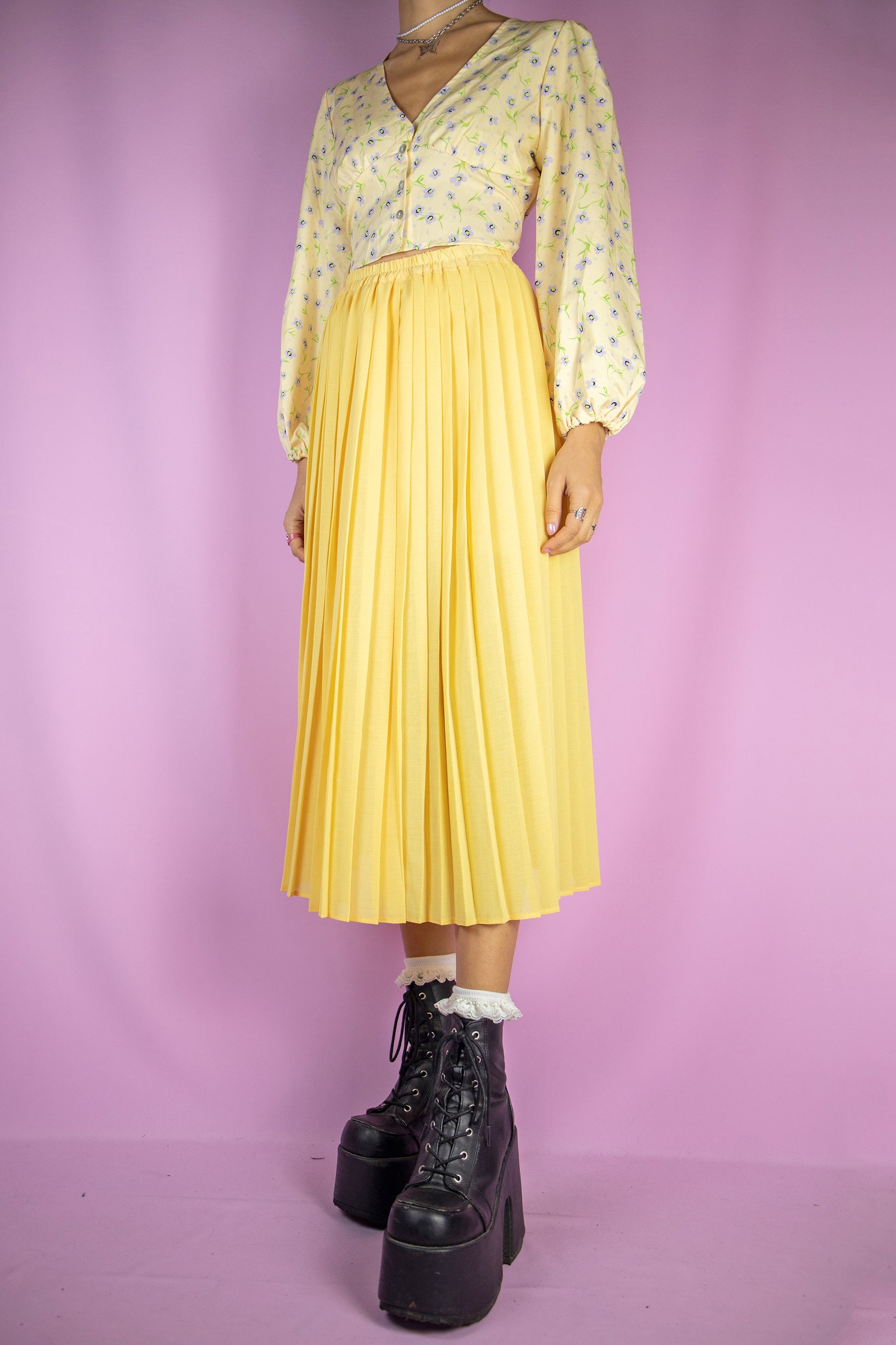 The Vintage 90s Yellow Pleated Midi Skirt is a long pleated yellow skirt with an elasticated waist. Lovely classic preppy 1990s. maxi skirt.