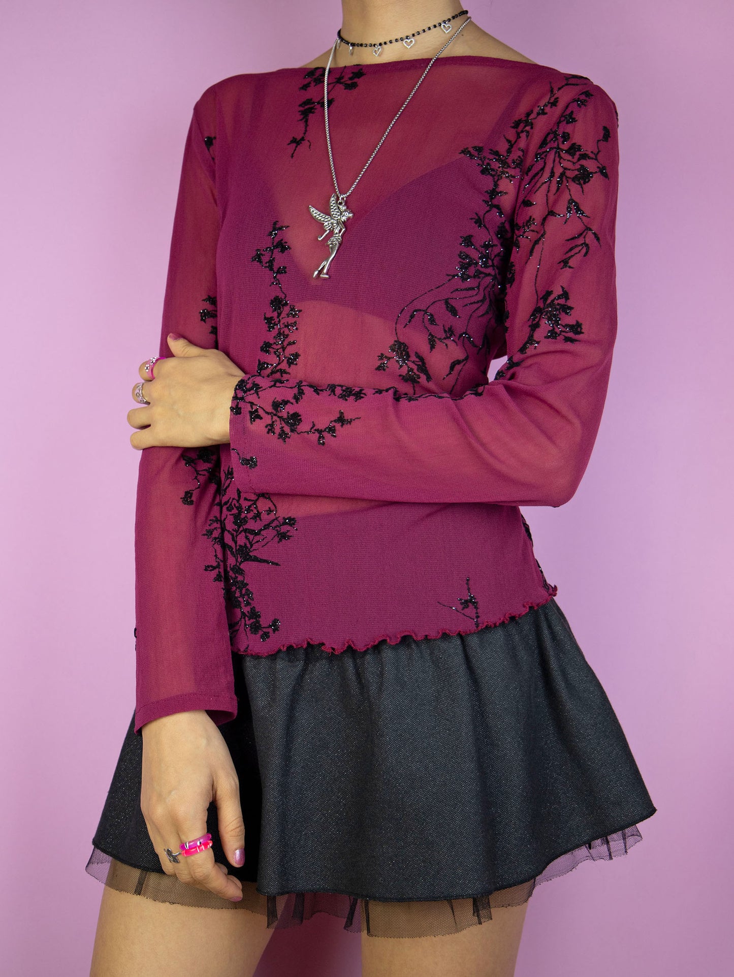 The Vintage 90s Maroon Mesh Top is a burgundy red long sleeve semi-sheer mesh top with black sparkly floral details, back button closure and lettuce hem. Lovely dark romantic fairy goth 1990s shirt.