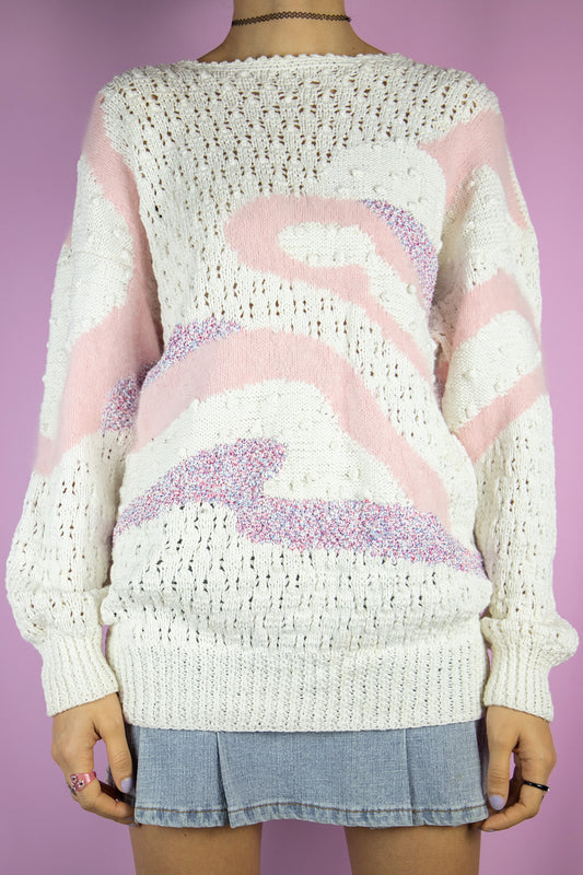 The Vintage 80s Retro White Knit Sweater is a knitted white sweater with an abstract pattern and pink, red and blue details. Romantic boho 1980s pastel pullover.