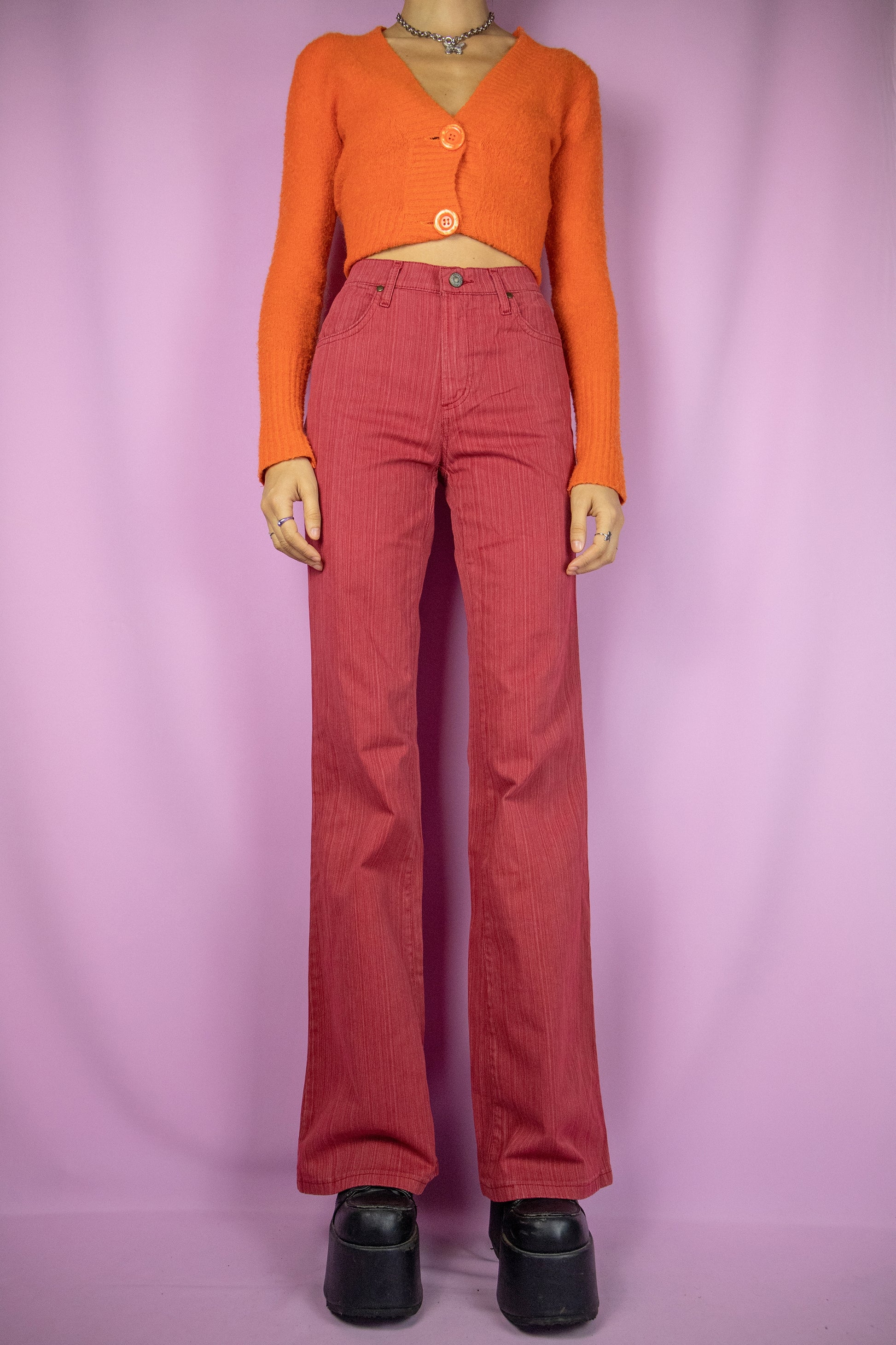 The Vintage Y2K Red Flare Jeans are slightly stretchy wide flared red striped pants with pockets. Cute 2000s cyber trousers.
