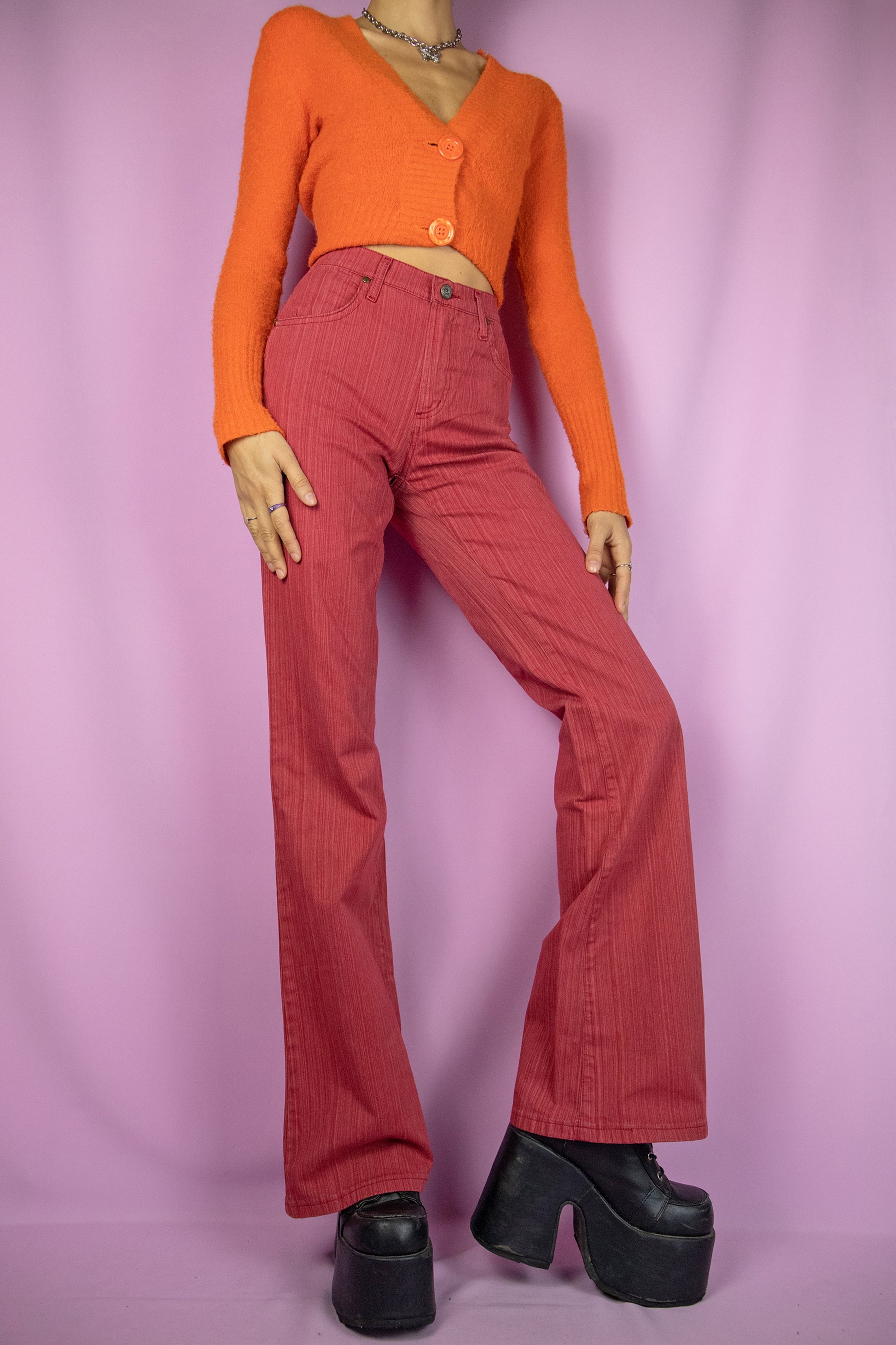 The Vintage Y2K Red Flare Jeans are slightly stretchy wide flared red striped pants with pockets. Cute 2000s cyber trousers.