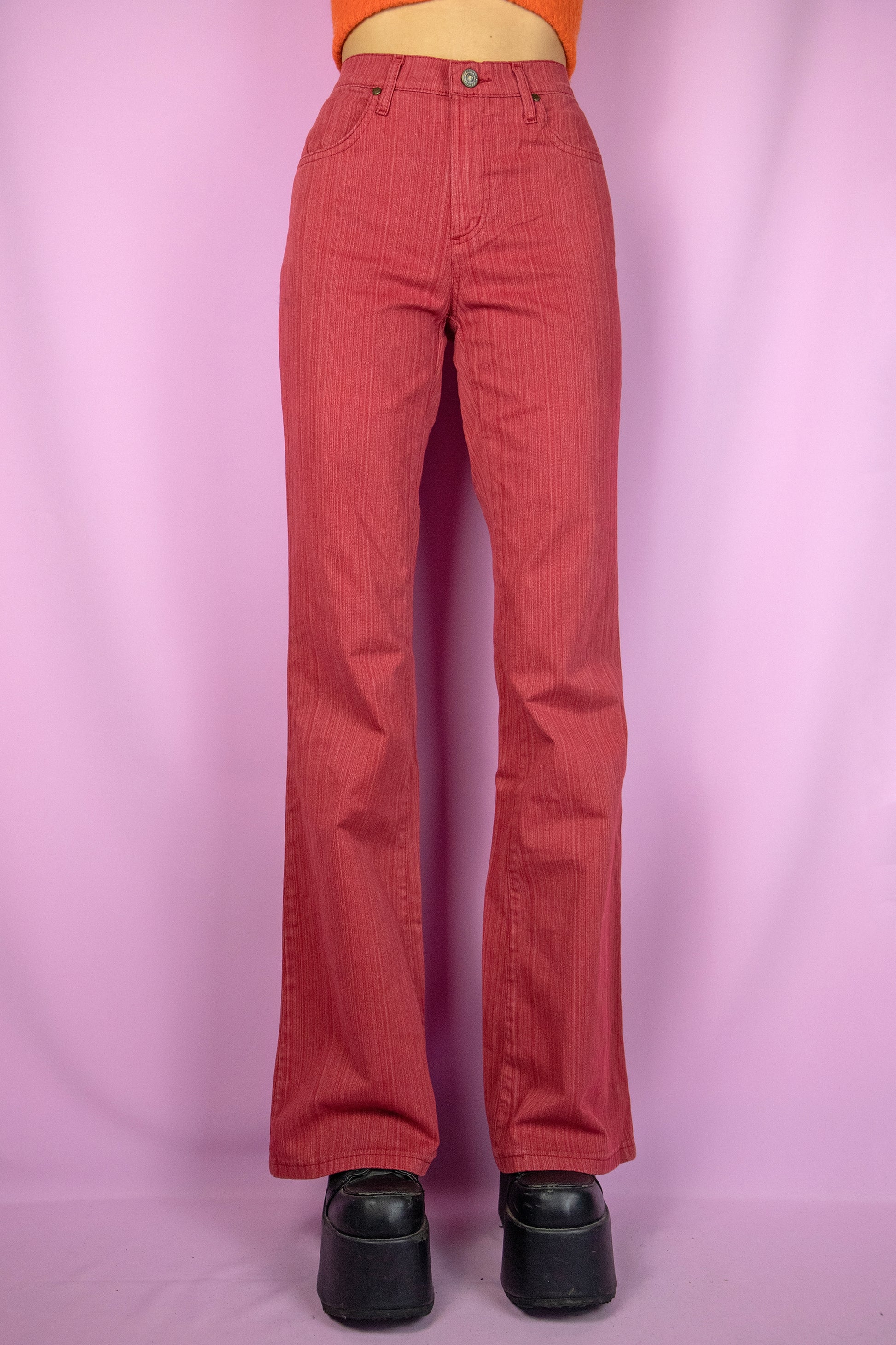 The Y2K Red Flare Jeans are vintage 2000s high-waisted, slightly stretchy pants with pockets and a zipper closure. Made in Spain. Excellent vintage condition.