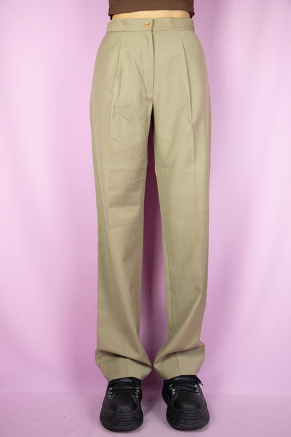 The Vintage 90s Beige Pleated Pants are beige wide pants with pleats, a zipper closure and pockets. Elegant classic tailored 1990s office pleated tapered trousers.