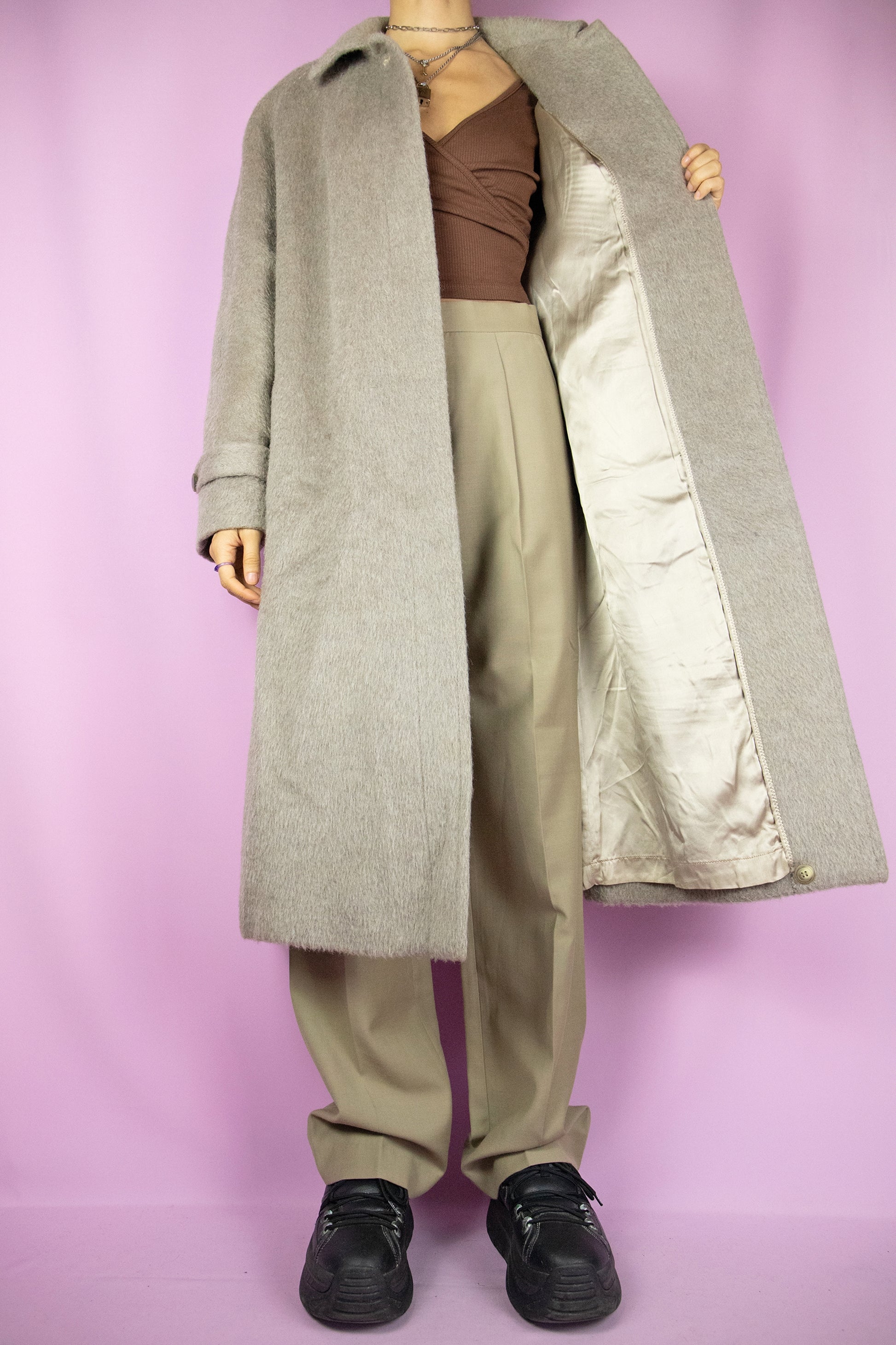 The Vintage 90s Beige Long Wool Coat is a light brown alpaca with merino wool blend maxi jacket with collar, buttons and pockets. Elegant classic retro 1990s winter statement coat.