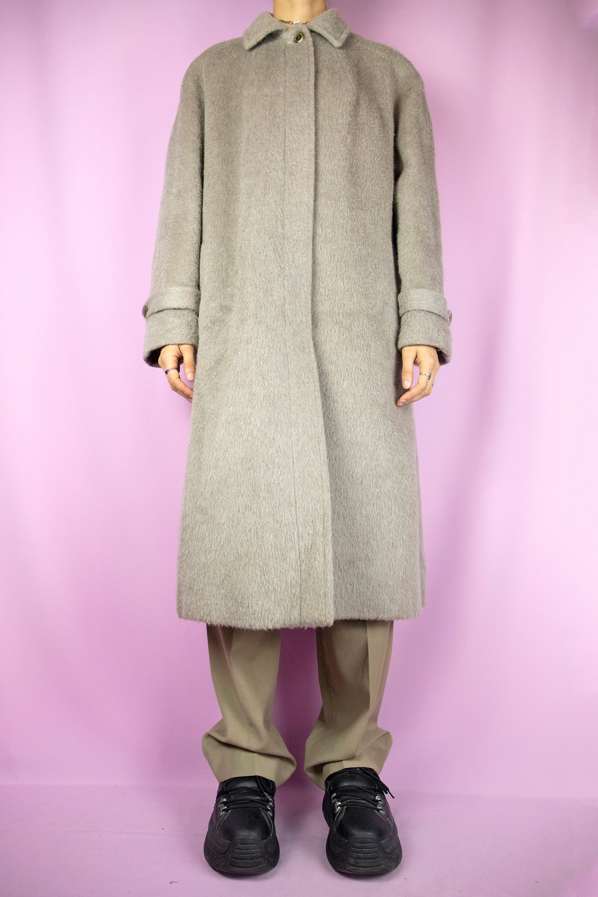 The Vintage 90s Beige Long Wool Coat is a light brown alpaca with merino wool blend maxi jacket with collar, buttons and pockets. Elegant classic retro 1990s winter statement coat.
