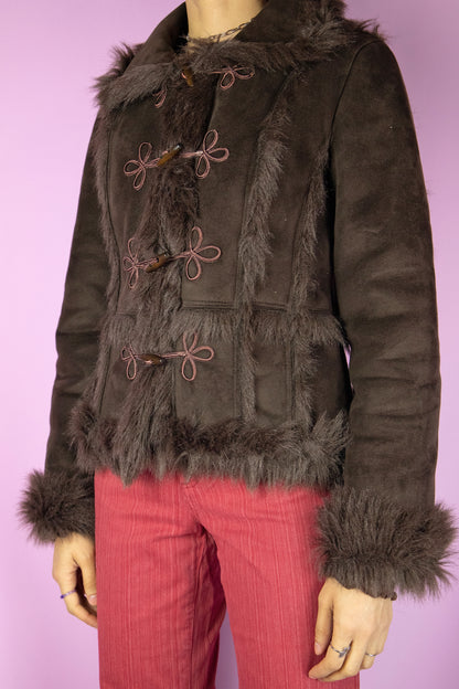 The Y2K Brown Penny Lane Jacket is a vintage dark brown faux suede jacket with faux fur lining, collar and cuffs. Cyber fairy grunge afghan style 2000s winter statement coat.